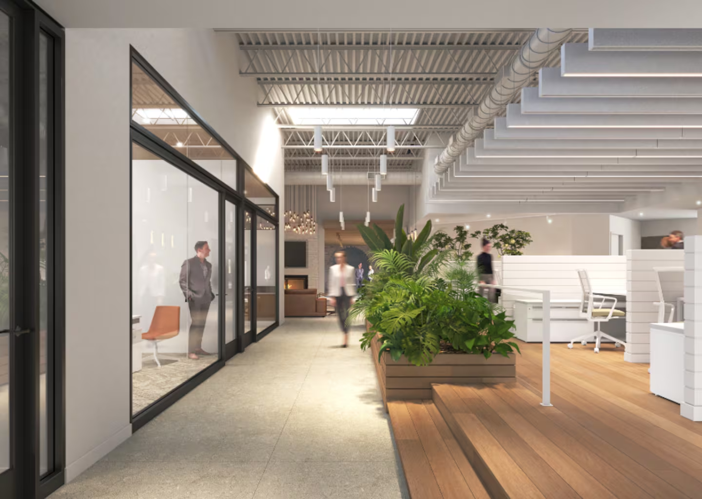 Open workspace and glass-front meeting rooms mirror the design of the adjoining 2022 building.